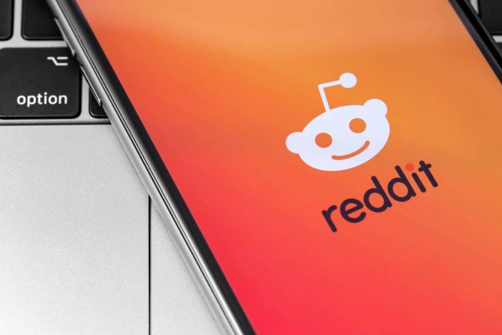 How to View Deleted Reddit Posts image - Reddit logo on the screen smartphone. Reddit - Social News Site. Moscow, Russia - November 15, 2019