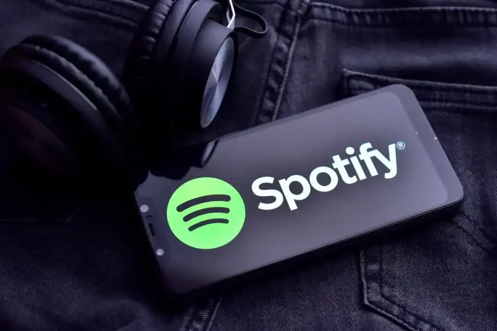 Spotify logo on smart phone screen - spotify-3